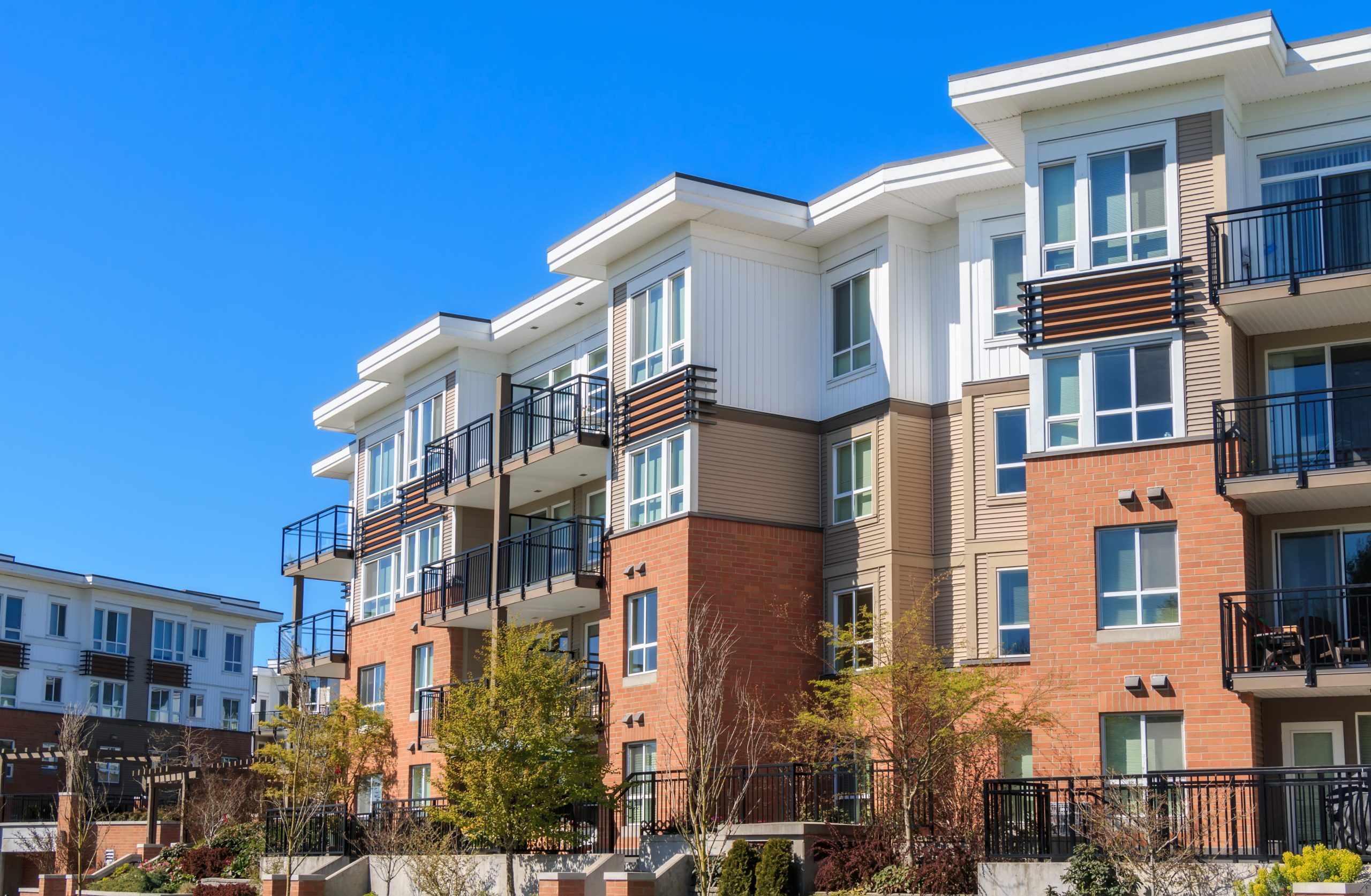 Architectural details of modern apartment building showing the power of Passive Investing in Commercial Multifamily Real Estate